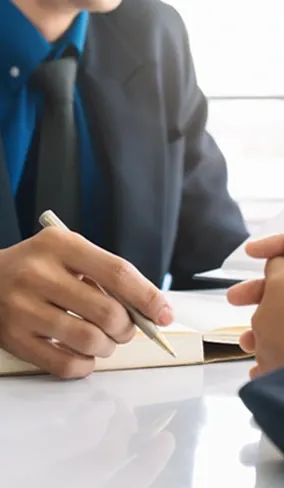 Signing documents at a table
